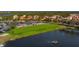 Putting green with water feature and homes at 9607 Sea Turtle Ter # 101, Bradenton, FL 34212