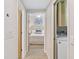 Hallway view of bedroom and laundry facilities at 9607 Sea Turtle Ter # 101, Bradenton, FL 34212
