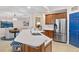 Modern kitchen with stainless steel appliances and a large island at 9607 Sea Turtle Ter # 101, Bradenton, FL 34212