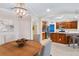 Modern kitchen with wooden cabinets, stainless steel appliances, and a blue accent wall at 9607 Sea Turtle Ter # 101, Bradenton, FL 34212