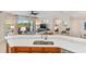 Modern kitchen with a breakfast bar and views into the living area at 9607 Sea Turtle Ter # 101, Bradenton, FL 34212