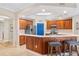 Modern kitchen with stainless steel appliances and a breakfast bar at 9607 Sea Turtle Ter # 101, Bradenton, FL 34212