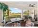 Spacious lanai with wicker furniture and stunning outdoor views at 9607 Sea Turtle Ter # 101, Bradenton, FL 34212
