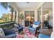 Relaxing screened lanai with comfortable seating for outdoor enjoyment at 9607 Sea Turtle Ter # 101, Bradenton, FL 34212