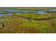 Aerial view of lush landscape and waterways at 9607 Sea Turtle Ter # 101, Bradenton, FL 34212