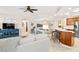 Open living room features a spacious layout with comfortable seating and large TV at 9607 Sea Turtle Ter # 101, Bradenton, FL 34212
