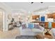 Bright living room with comfortable sofas and access to the dining area at 9607 Sea Turtle Ter # 101, Bradenton, FL 34212