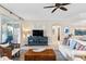 Bright living room boasts comfortable seating, a large TV, and access to a balcony at 9607 Sea Turtle Ter # 101, Bradenton, FL 34212