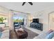 Spacious living room with patio access and view of the water at 9607 Sea Turtle Ter # 101, Bradenton, FL 34212