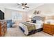 Relaxing main bedroom with a comfortable seating area and access to a patio at 9607 Sea Turtle Ter # 101, Bradenton, FL 34212