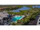 Resort-style pool with clubhouse and lush landscaping at 9607 Sea Turtle Ter # 101, Bradenton, FL 34212