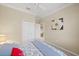 Bedroom with a queen bed and access to hallway at 101 Bolanza Ct, North Venice, FL 34275