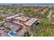 Aerial view showing building, pool, and surrounding neighborhood at 101 Park S Blvd # 111, Venice, FL 34285