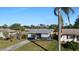 Cute single story home with a spacious yard and a palm tree at 1040 Hope St, Venice, FL 34285
