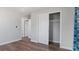 Bedroom with wood floors and sliding door closet at 1040 Hope St, Venice, FL 34285