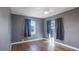 Bedroom with gray walls, wood floors, and ceiling fan at 1040 Hope St, Venice, FL 34285