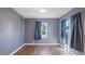 Bedroom with gray walls, wood floors, and ceiling fan at 1040 Hope St, Venice, FL 34285