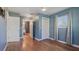 Bedroom with wood floors and access to a bathroom and closet at 1040 Hope St, Venice, FL 34285