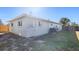 Back exterior of the house with AC unit and fence at 1040 Hope St, Venice, FL 34285