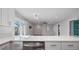 Open kitchen features a breakfast bar overlooking the living room at 1040 Hope St, Venice, FL 34285