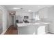 Modern kitchen with white cabinets, stainless steel appliances and quartz countertops at 1040 Hope St, Venice, FL 34285