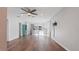 Spacious living room with hardwood floors and modern ceiling fan at 1040 Hope St, Venice, FL 34285