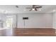 Open living area with hardwood floors and sliding glass doors at 1040 Hope St, Venice, FL 34285
