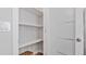 White pantry with two shelves, providing ample storage space at 1040 Hope St, Venice, FL 34285