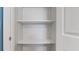 Open shelving with three white shelves at 1040 Hope St, Venice, FL 34285