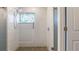 Shower with glass enclosure, mosaic tile floor and stained glass window at 1040 Hope St, Venice, FL 34285