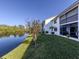 Peaceful backyard oasis with pond views and lush landscaping at 1100 Capri Isles Blvd # 212, Venice, FL 34292