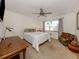 Bright bedroom with a comfortable bed and a ceiling fan at 1100 Capri Isles Blvd # 212, Venice, FL 34292
