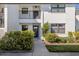 Inviting condo entrance with lush landscaping at 1100 Capri Isles Blvd # 212, Venice, FL 34292