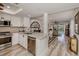 Open concept kitchen with island and stainless steel appliances at 1100 Capri Isles Blvd # 212, Venice, FL 34292