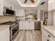 Modern kitchen with stainless steel appliances and granite counters at 1100 Capri Isles Blvd # 212, Venice, FL 34292