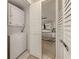 Convenient laundry closet with stackable washer and dryer at 1100 Capri Isles Blvd # 212, Venice, FL 34292