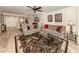 Bright living room featuring hardwood floors, comfy seating, and a large area rug at 1100 Capri Isles Blvd # 212, Venice, FL 34292