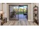 Living room with view of patio and water at 1100 Capri Isles Blvd # 212, Venice, FL 34292