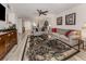 Bright living room featuring hardwood floors, comfy seating, and a large area rug at 1100 Capri Isles Blvd # 212, Venice, FL 34292