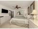 Spacious main bedroom with king-size bed and access to the patio at 1100 Capri Isles Blvd # 212, Venice, FL 34292