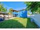 Large backyard with covered patio and grill at 113 Colonia W Ln, Nokomis, FL 34275