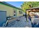 Backyard view of home with patio and grill at 113 Colonia W Ln, Nokomis, FL 34275