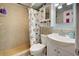 Bathroom with beige tile, shower/tub combo, and white vanity at 113 Colonia W Ln, Nokomis, FL 34275