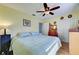 Spacious bedroom with ample closet space and ceiling fan at 113 Colonia W Ln, Nokomis, FL 34275