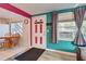 Bright entryway with teal and pink walls and tile floors at 113 Colonia W Ln, Nokomis, FL 34275