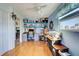 Home office with built-in shelving and hardwood floors at 113 Colonia W Ln, Nokomis, FL 34275