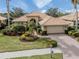 Single-Gathering home with landscaped yard and driveway at 114 Medici Ter, North Venice, FL 34275