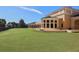 Large backyard with lush green grass at 114 Medici Ter, North Venice, FL 34275