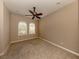 Bright bedroom with ceiling fan and neutral carpeting at 114 Medici Ter, North Venice, FL 34275