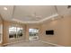 Spacious bedroom with pool view and ceiling fan at 114 Medici Ter, North Venice, FL 34275